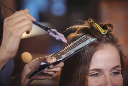 Woman getting her hair dyed