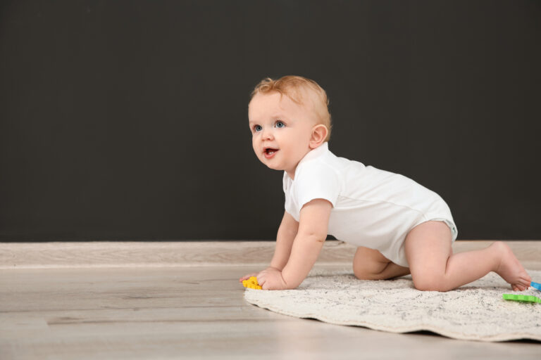 baby crawling on a rug