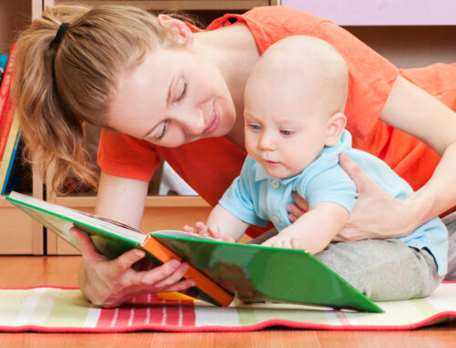 Mother reading a book to her baby