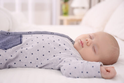 Baby asleep in sleeper pajamas