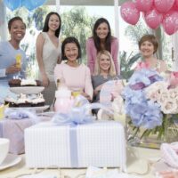 ladies in baby shower with gifts