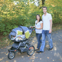 mom pushing britax travel system