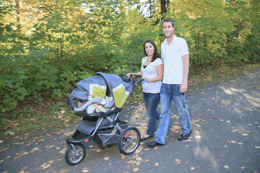 mom pushing britax travel system