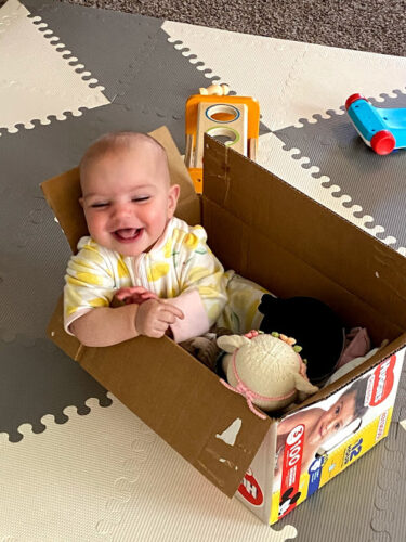 baby learning to sit in box