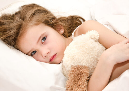 Little girl ready to sleep in her bed