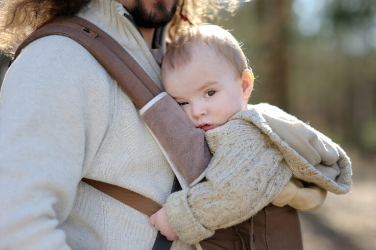 dad with baby girl in baby carrier