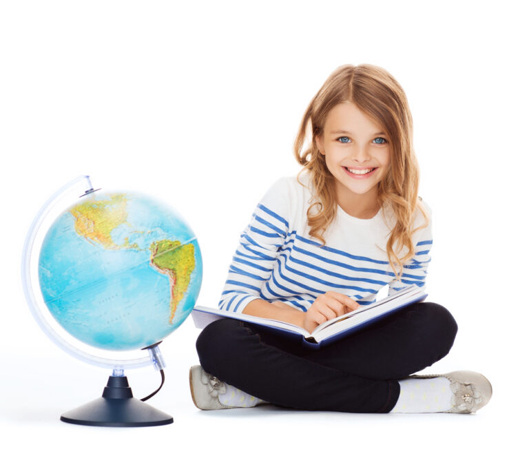 girl sitting with globe and book