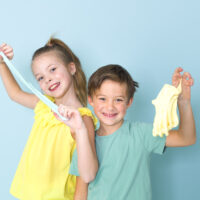 girl and boy playing with slime