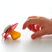 Baby Reaching for His Pacifier