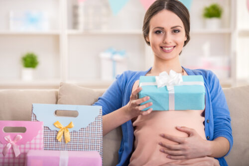 pregnant woman with gifts at a baby shower