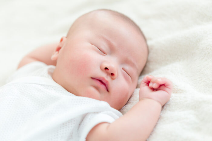 baby sleeping on their back