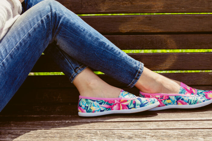 mom sitting on park bench wearing comfortable and cute shoes