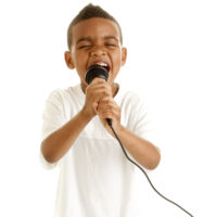 boy singing into a microphone