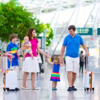 Family with children at airport