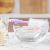 bowl of hot water for cleaning baby bottles