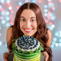 Girl with happy birthday cake