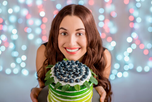 Girl with happy birthday cake