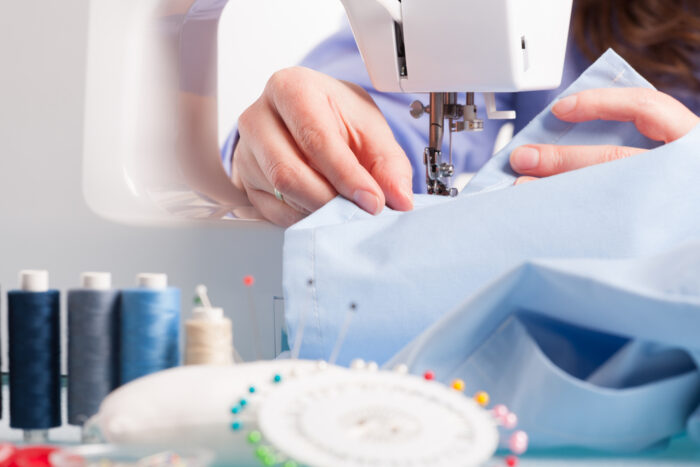 woman sewing fabric