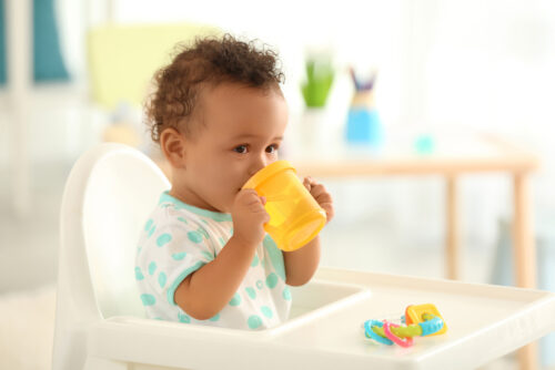 baby drinking from a sippy cup