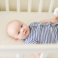 baby laying in crib awake