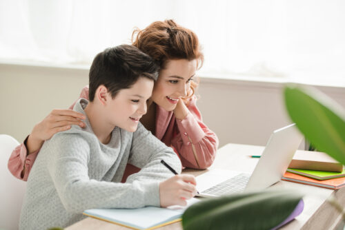 mother and son homeschooling together