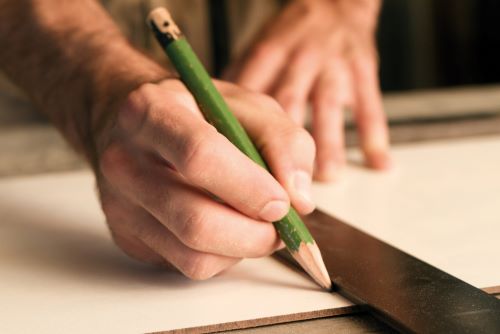 marking a piece of wood for cutting
