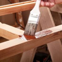 staining baby gate wood frame with brush